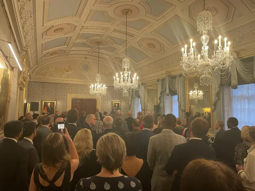 A shot of the crowd at the event, in an ornate room