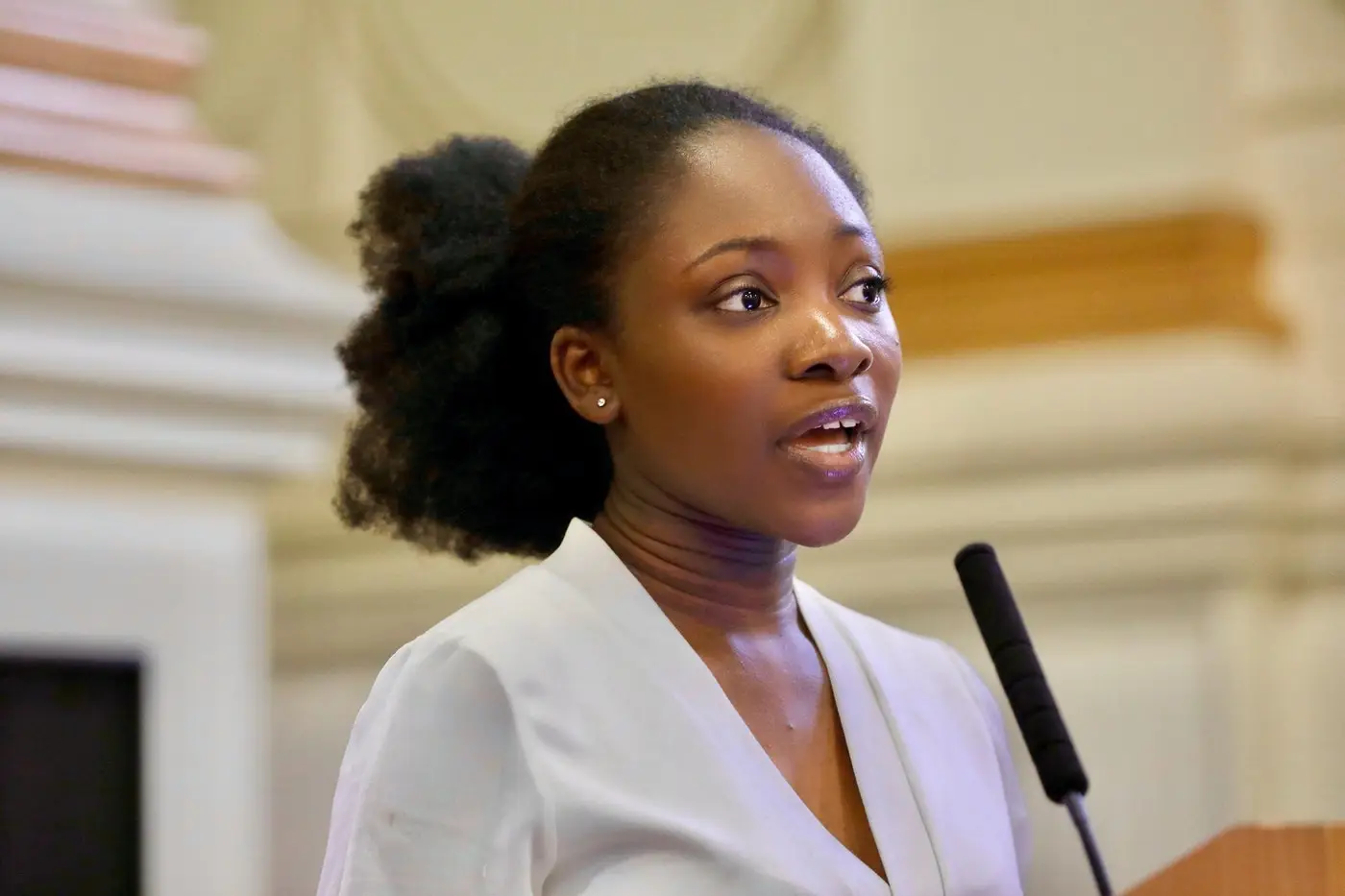 Portrait of Kadija speaking at an event 